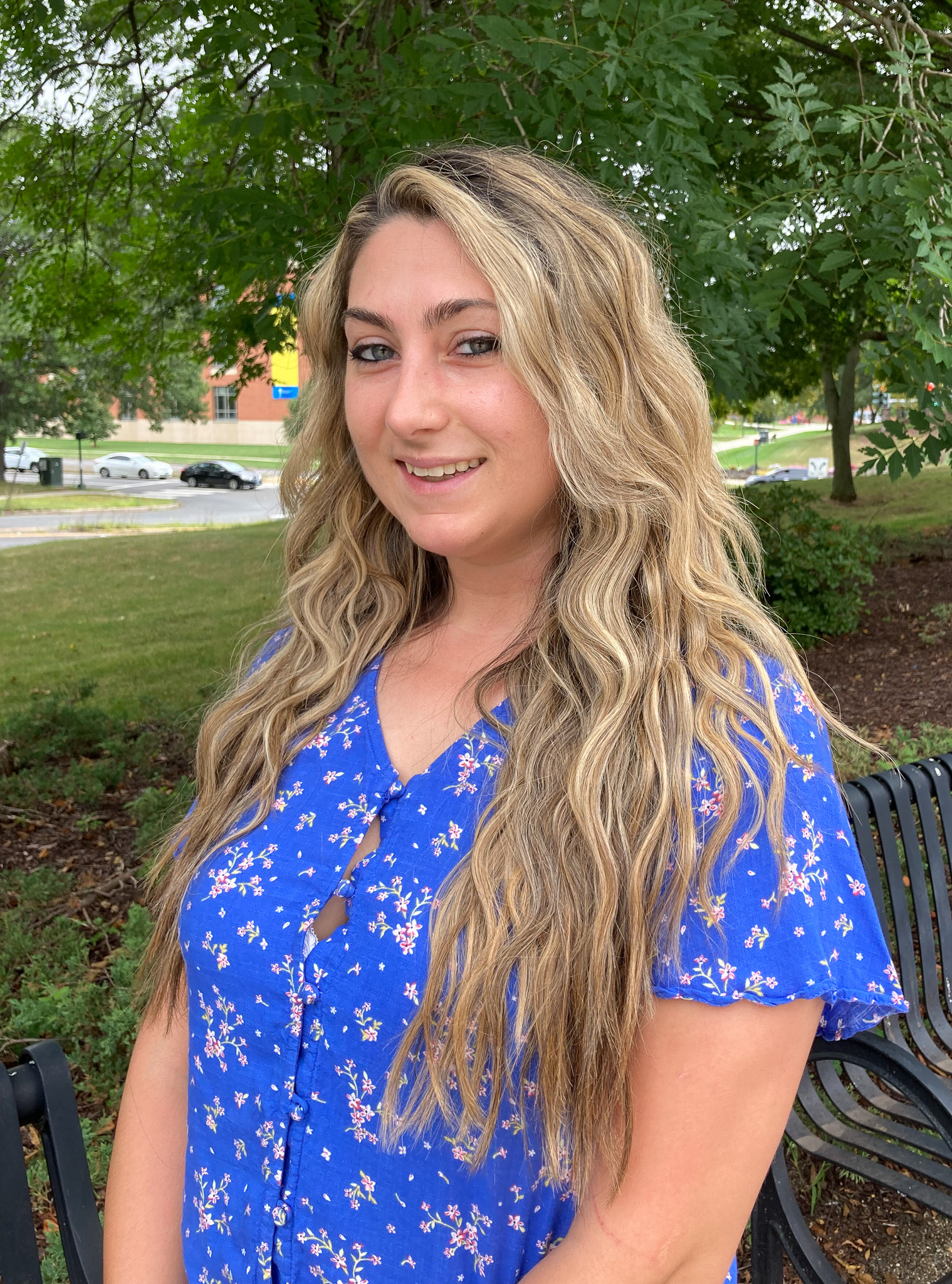 Woman in blue floral shirt